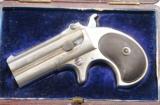 MINT CASED REMINGTON TYPE II O/U .41 RF CAL. DOUBLE DERRINGER WITH BRITISH PROOFS CA. 1888.
- 1 of 11