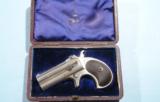 MINT CASED REMINGTON TYPE II O/U .41 RF CAL. DOUBLE DERRINGER WITH BRITISH PROOFS CA. 1888.
- 2 of 11