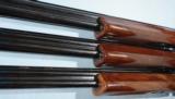 CASED LIKE NEW BELGIAN BROWNING SUPERPOSED THREE BARREL SET MIDAS GRADE 20GA. WITH TWO EXTRA SETS OF 12GA, BARRELS, CIRCA 1972 - 9 of 10