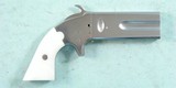 REPRODUCTION AMERICAN ARMS COMPANY PERCUSSION SWIVEL BREECH .36 CAL. DOUBLE BARREL DERRINGER CIRCA 1960’S. - 1 of 2