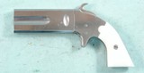 REPRODUCTION AMERICAN ARMS COMPANY PERCUSSION SWIVEL BREECH .36 CAL. DOUBLE BARREL DERRINGER CIRCA 1960’S. - 2 of 2