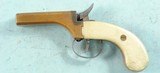 REPRODUCTION PERCUSSION BRASS DOUBLE BARREL .36 CAL. DERRINGER CIRCA 1960’S. - 2 of 3