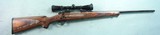 WINCHESTER MODEL 70 FEATHERWEIGHT .280 REM. CAL. RIFLE W/REDFIELD 2X7 TRACKER SCOPE AND ORIGINAL BOX. - 1 of 8