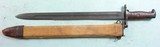EARLY STYLE WW1 OR WWI U.S. MODEL 1905 "1918" RIFLE BAYONET WITH ORIGINAL CANVAS COVERED M1910 SCABBARD. - 1 of 10