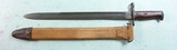 EARLY STYLE WW1 OR WWI U.S. MODEL 1905 "1918" RIFLE BAYONET WITH ORIGINAL CANVAS COVERED M1910 SCABBARD. - 2 of 10