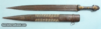 GEORGIAN OR CAUCASIAN QAMAS KINJAL AND SCABBARD WITH SILVER INLAY CIRCA EARLY 19TH CENTURY.
