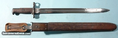 WW2 U.S. NAVY MARK 1 TRAINING BAYONET W/ORIG. U.S.N. MK.1 SCABBARD. Ricasso stamped “B.M. CO.” and “U.S.N./MARK 1”