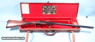 EXCEPTIONAL CASED JOSEPH LANG & SON, LONDON 12 GAUGE EJECTOR FACTORY SINGLE TRIGGER NEW CENTURY SIDE X SIDE SHOTGUN CIRCA 1904.