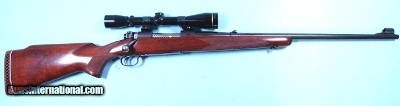 PRE-64 WINCHESTER MODEL 70 BOLT ACTION .30-06 CAL. RIFLE MANUFACTURED IN 1954 W/ SCOPE.