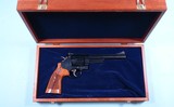 SMITH & WESSON MODEL 29 10 OR 29-10 .44 MAG. 6 1/2” REVOLVER NEW IN FACTORY BLUE BOX AND WITH WOOD DISPLAY CASE AS WELL.