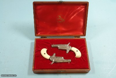 CASED PAIR OF COLT 4th MODEL LORD & LADY STYLE (LATER NAMED) .22 SHORT SINGLE SHOT DERRINGER OR DERINGER PISTOLS, CIRCA 1960-63.