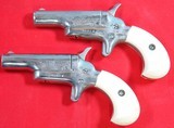 CASED PAIR OF COLT 4th MODEL LORD & LADY STYLE (LATER NAMED) .22 SHORT SINGLE SHOT DERRINGER OR DERINGER PISTOLS, CIRCA 1960-63. - 2 of 4