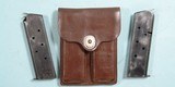 31947- U.S. 1950 OFFICERS LEATHER MODEL 1911A1 1911-A1 DOUBLE MAGAZINE POUCH WITH TWO MAGAZINES.