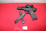 Ruger Mark 4
Tactical with extras 22