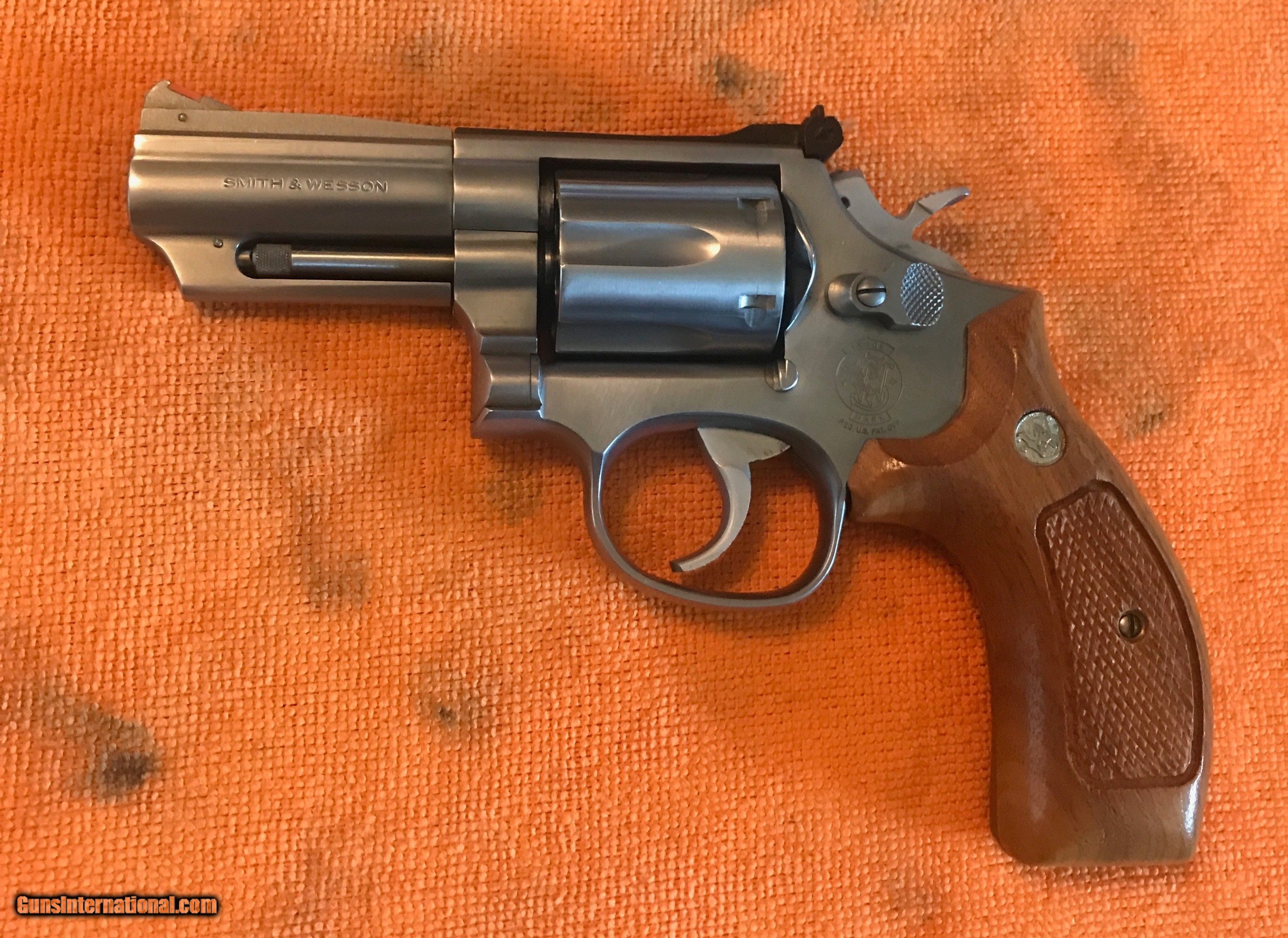 Smith and Wesson 66-3 (3 inch, stainless, smooth combat stocks)