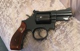 Smith and Wesson 19-5 (2 in, blue, wood grips) - 2 of 8