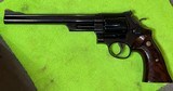 Smith and Wesson 57 (8 3/8ths, blue, targets) - 2 of 6