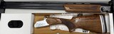 SKB 90TSS Sporting 12ga 30” Barrel Adjustable Stock Left Hand. Length of Pull 14”-15.25”, Drop at Heel 2 3/8”, Drop at Comb 1 5/8”, Chokes: M,LM - 1 of 4