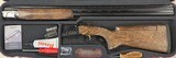 Perazzi MX2000 S 12ga 32” Barrel Adjustable Comb. Glossy polished frame, pierced top lever, SC2 wood upgrade. New in case.