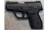 Taurus ~ 709 Slim ~ 9 mm Luger. - 2 of 2
