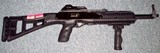 High Point 995 Carbine with forward folding grip. - 1 of 3