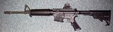 Bushmasrer M4 with ADJUSTABLE sights. - 1 of 5