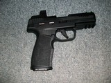 Sig Sauer P322 with Romeo sight
.22 Cal. - 2 of 3