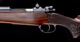 Fantastic Hoffman Arms Bolt Action Rifle in .300 Mag with beautiful carved stocks - 1 of 9