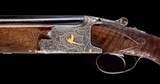 Incredible cased 20ga Browning Superposed Exhibition - Field Configured with Gold inlays and factory carved stocks - Extremely Choice in every regard!