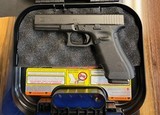 As new Glock G17 Gen 4 9mm with case - 1 of 2