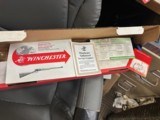 WINCHESTER 9422 XTR 22LR
WITH BOXES, RACK AND FRAMED PICTURE - 18 of 21