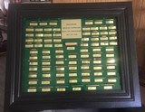 Winchester Cartridge Board - (86) Antique Cartridges - Cartridges are imbedded in liquid glass. - 1 of 3