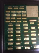 Winchester Cartridge Board - (86) Antique Cartridges - Cartridges are imbedded in liquid glass. - 2 of 3