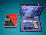 LLAMA, .22 AUTO
FACTORY ENGRAVED ,NICKEL, MATCHING BOX AND PRESENTATION CASE - 1 of 11
