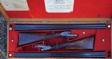 a matched pair of 12 bore James Woodward Automatic sidelock extractor shotguns. - 1 of 15