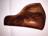 Cowboy holster -1920's tan leather -original etched scroling
- 5 of 6