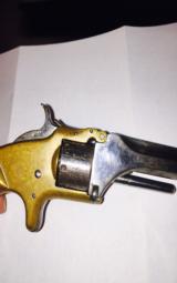 S&W first model - 7 shot 22 caliber-
brass frame-
spur trigger -made in 1866 - 8 of 10
