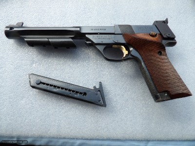 HIGH STANDARD SUPERMATIC TROPHY IN EXCELLENT CONDITION & MUZLE BRAKE.