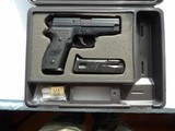 SIG SAUER P229 SEMI AUTO PICTOL IN LIKE NEW FACTORY IN BOX CONDITION
