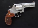 Smith & Wesson Model 686-5, Jeff Flannery Engraved, Cal. .357 Magnum
4 Inch Stainless
S&W Mod. 686
- 4 of 9