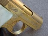 Custom Gold Plated & Engraved Bauer .25 Auto with 14K Lion Head Grips
SOLD - 24 of 25