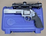 SMITH AND WESSON MODEL 617-6 WITH SCOPE, SPEED LOADED AND MATCHING BOX .22LR SOLD - 1 of 25