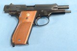 **SOLD**
Smith & Wesson Model 39-2 Semi Auto Pistol in 9mm **Mfg 1976 - 1st Gen Semi Auto - Box, Papers, Cleaning Items and 2 Magazines** - 17 of 19