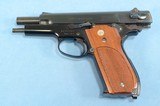 **SOLD**
Smith & Wesson Model 39-2 Semi Auto Pistol in 9mm **Mfg 1976 - 1st Gen Semi Auto - Box, Papers, Cleaning Items and 2 Magazines** - 16 of 19