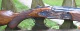 B, RIZZINI - 20 ga. OVER/UNDER SIDEPLATED BOXLOCK - CASE COLORED GAME SCENE ENGRAVED -
29 1/4" SOLID RIB
- 4 of 11