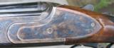 B, RIZZINI - 20 ga. OVER/UNDER SIDEPLATED BOXLOCK - CASE COLORED GAME SCENE ENGRAVED -
29 1/4" SOLID RIB
- 10 of 11