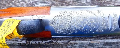 B. RIZZINI - 16 GA. OVER/UNDER ARTEMIS MODEL - TWO SETS OF VENT RIB BARRELS - 26 IC/M & 27 1/2