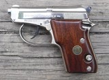 BERETTA  MODEL 21A - CAL. .22LR - SEMI AUTO PISTOL - DOUBLE ACTION -  2 1/2" TIP UP BARREL - NICKEL FINISH WITH WOOD GRIPS - 1 of 4