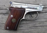 BERETTA  MODEL 21A - CAL. .22LR - SEMI AUTO PISTOL - DOUBLE ACTION -  2 1/2" TIP UP BARREL - NICKEL FINISH WITH WOOD GRIPS - 2 of 4