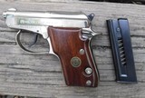 BERETTA  MODEL 21A - CAL. .22LR - SEMI AUTO PISTOL - DOUBLE ACTION -  2 1/2" TIP UP BARREL - NICKEL FINISH WITH WOOD GRIPS - 3 of 4